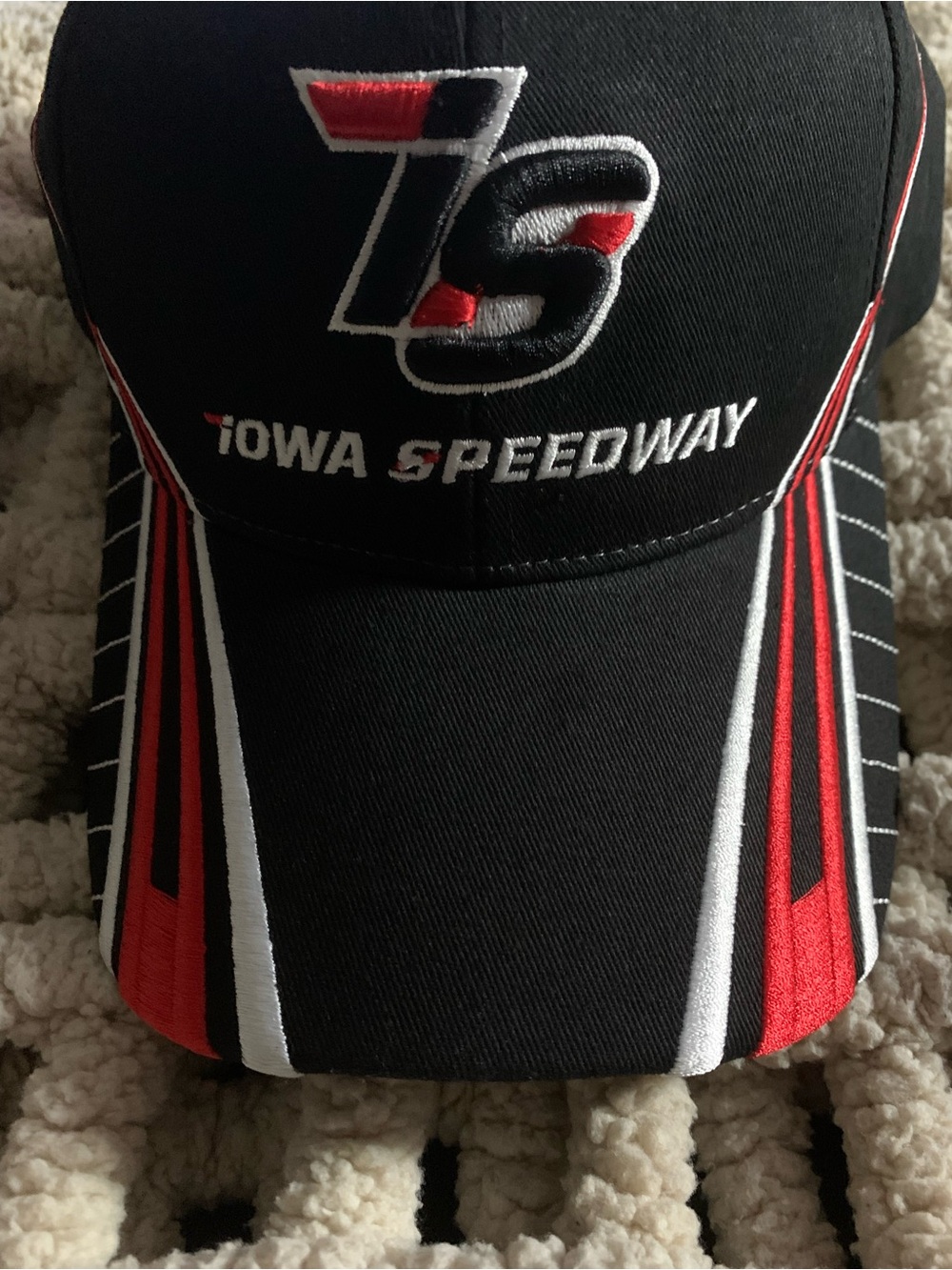 Iowa Speedway racing cap in black with red and white embroidered details